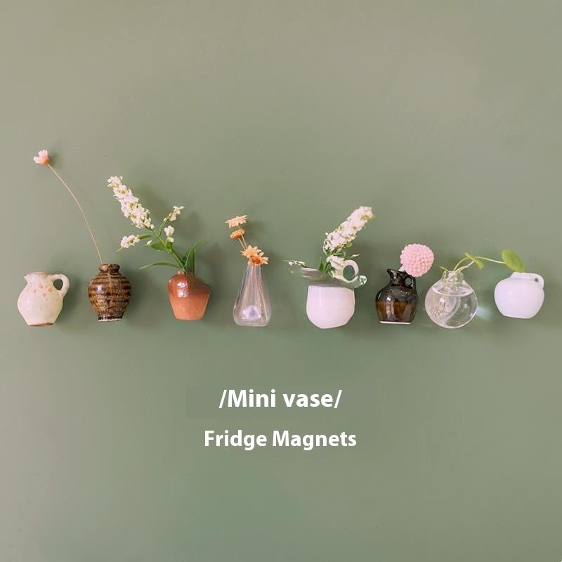Miniature vases displayed on a green background with text indicating they are fridge magnets.