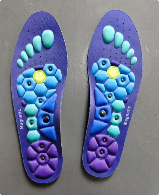 Pair of blue and purple shoe insoles with a floral pattern on a gray background