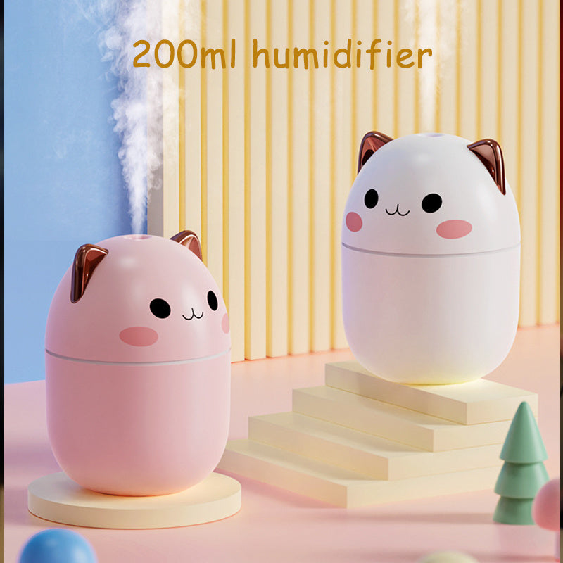 Two cute humidifiers shaped like cats on a colorful background