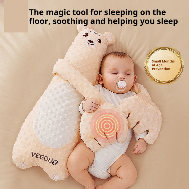 Baby lying on a soft pillow with a bear design, surrounded by text and VEEQO branding.