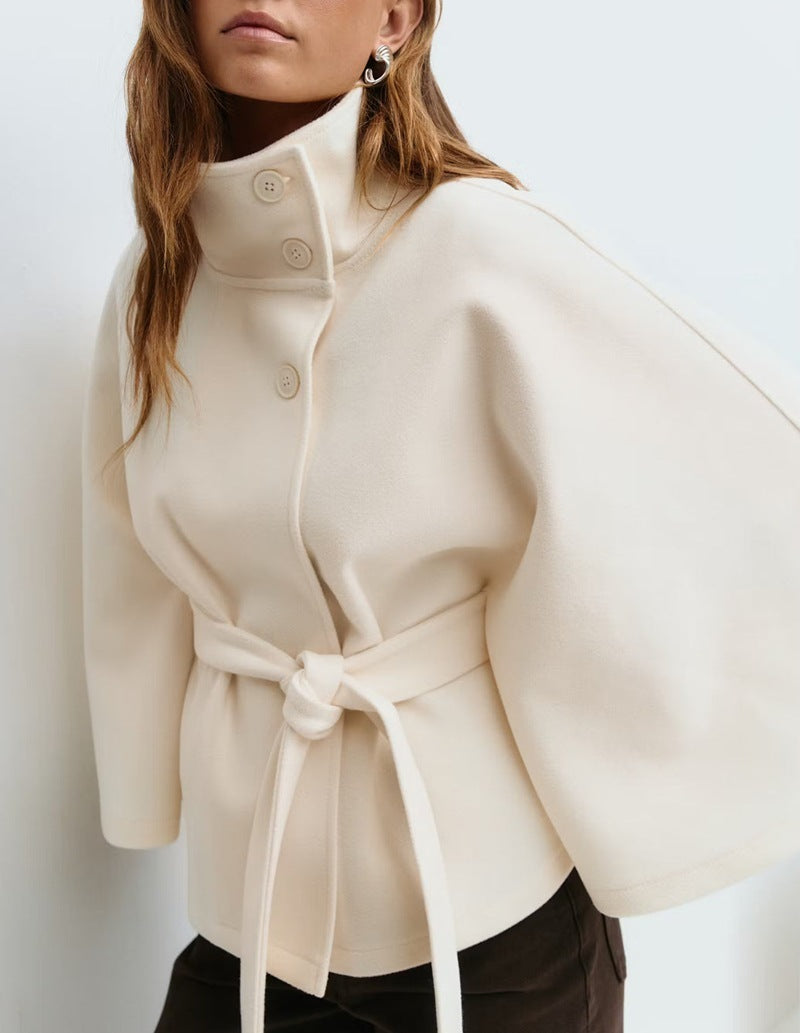Beige coat with a tie waist on a white background
