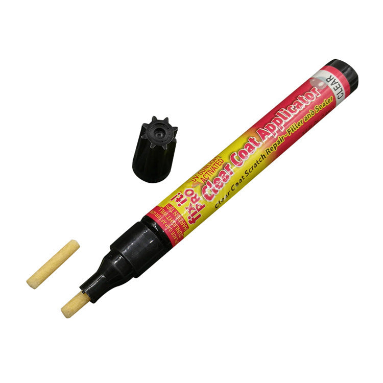 Clear coat applicator pen with brush attachment on a white background