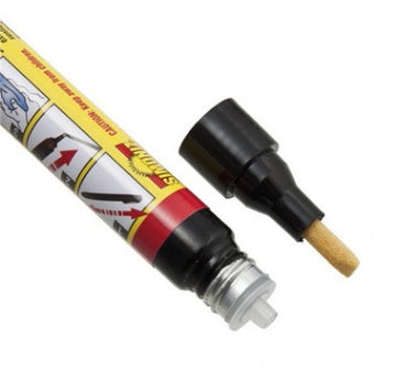 Car paint repair pen with black cap and wooden applicator on a white background