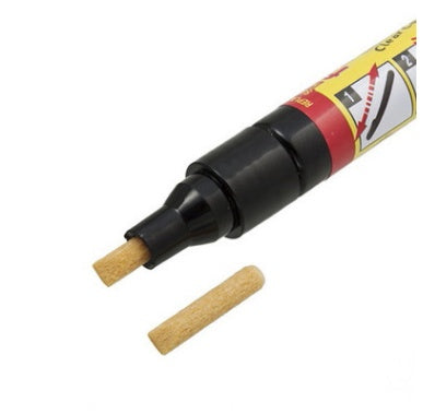 Black marker with cork tip on a white background