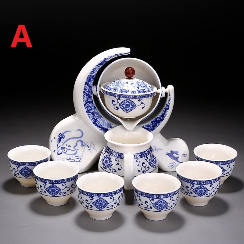Ceramic tea set with blue and white patterns on a dark background