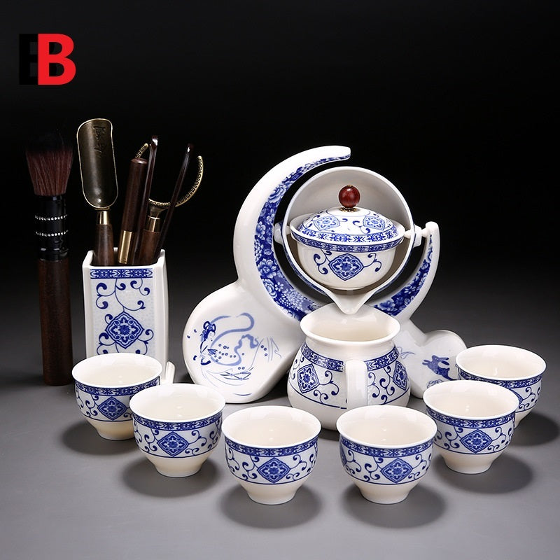 Ceramic tea set with blue and white patterns on a dark background