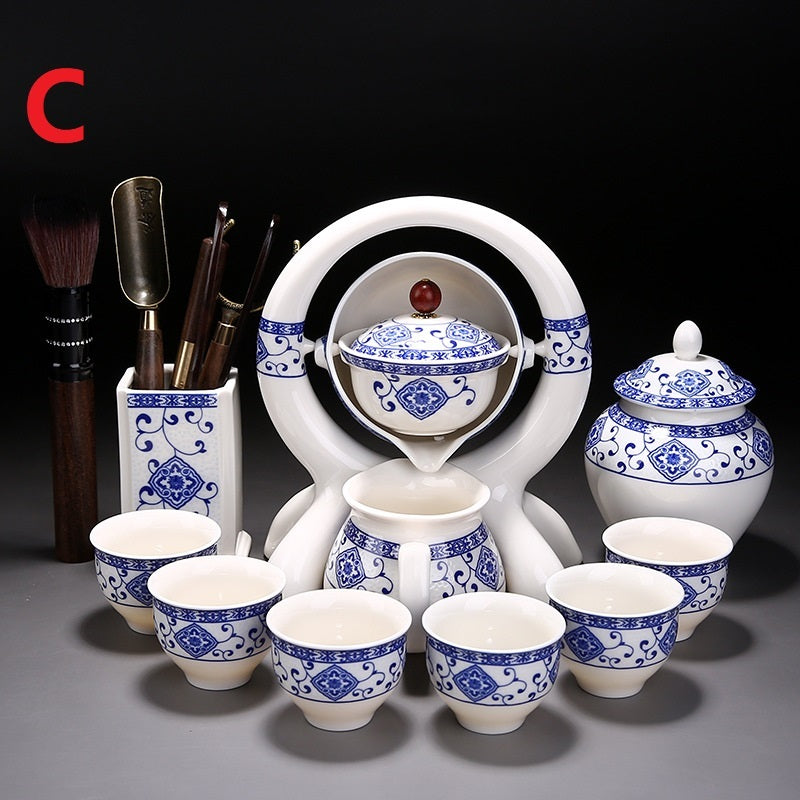 Ceramic tea set with blue and white patterns on a dark background