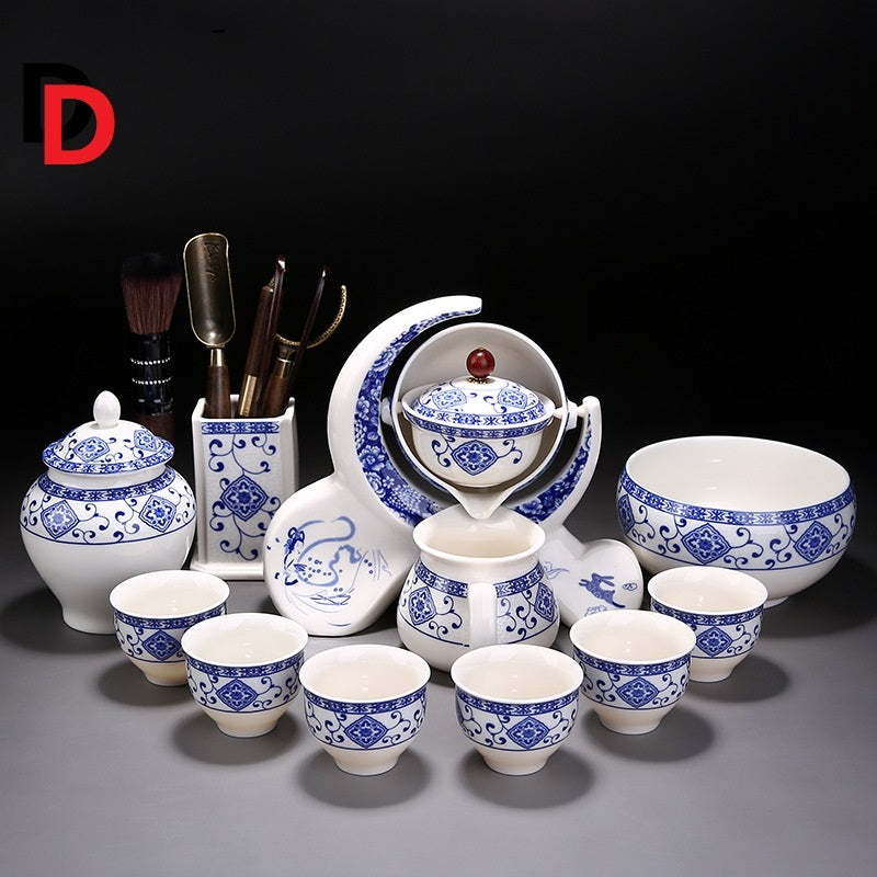 Ceramic tea set with blue and white patterns on a dark background