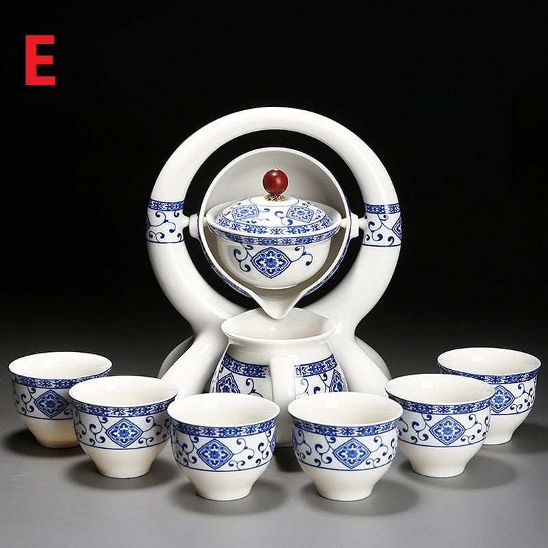 Ceramic tea set with blue and white patterns on a black background