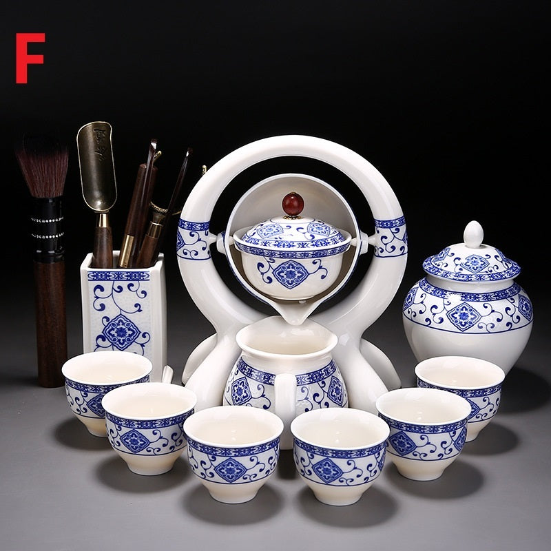 Ceramic tea set with blue and white patterns on a dark background