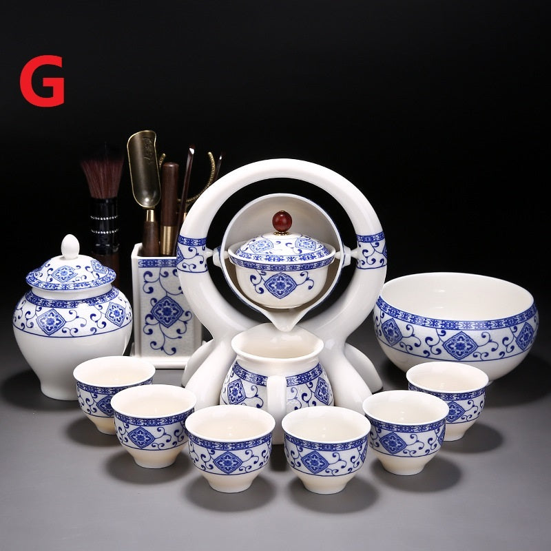 Ceramic tea set with blue and white patterns on a dark background