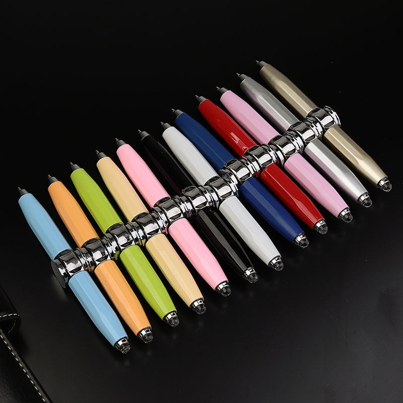 Set of colorful pens with metallic accents on a black background