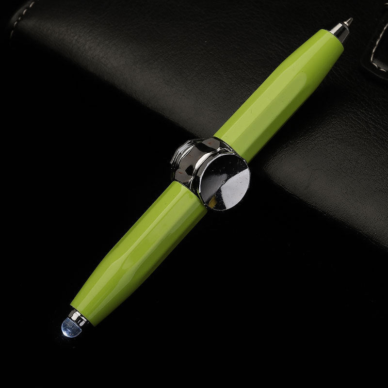 Green pen with silver accents on a black background