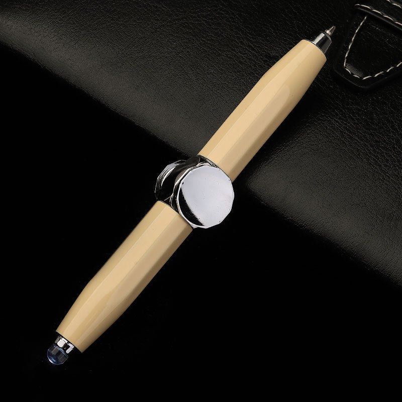 Beige pen with silver accents on a black background