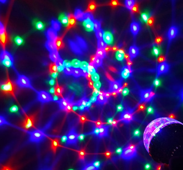 Colorful LED light hoop with multicolored lights on a dark background