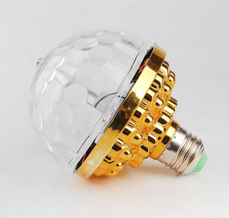 Decorative light bulb with gold and clear design on a white background