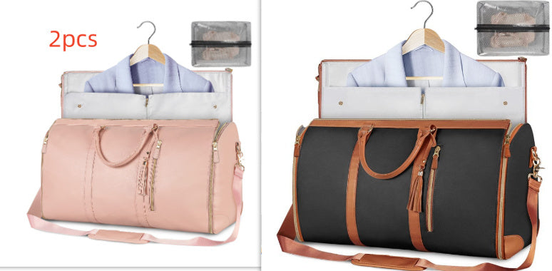 Two duffel bags with clothes inside, one pink and one black with brown handles, on a white background.