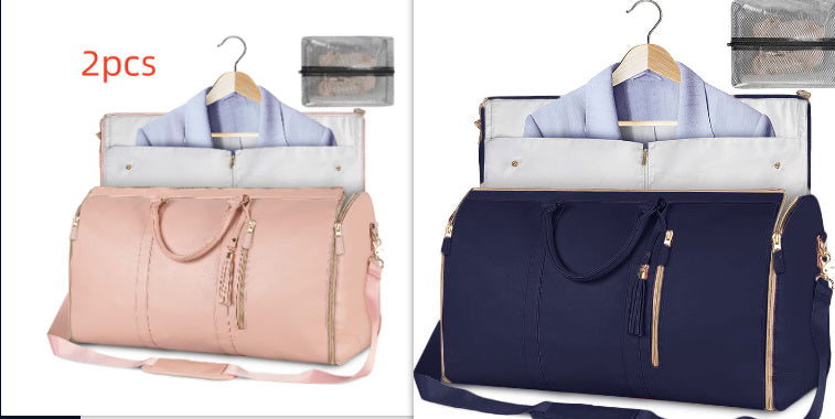 Two travel bags, one pink and one navy, with hangers and shirts inside on a white background.