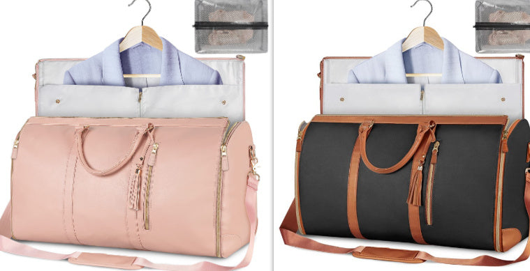 Two travel bags, one pink and one black with brown accents, on hangers with clothes inside.