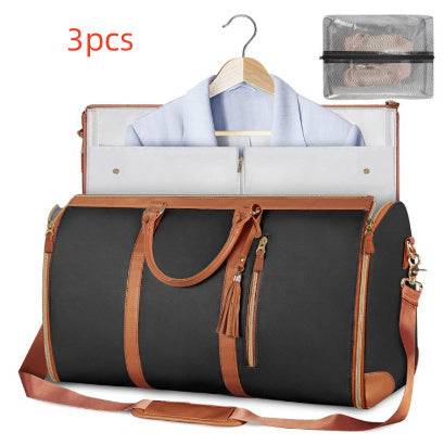 Black and brown travel bag with a shirt on a hanger and a mesh pouch on a white background.