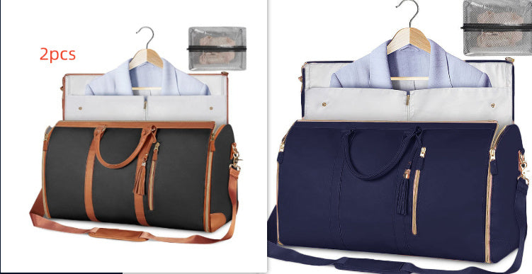 Two travel bags, one black with brown accents and the other navy blue, on hangers with shirts inside.