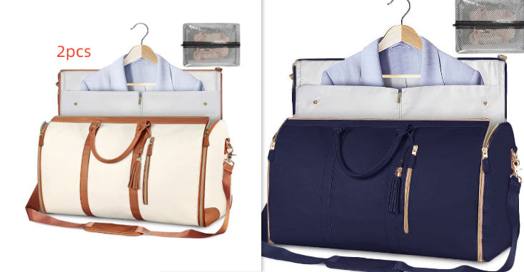 Two travel bags, one white with brown accents and one navy blue, on hangers with shirts inside.