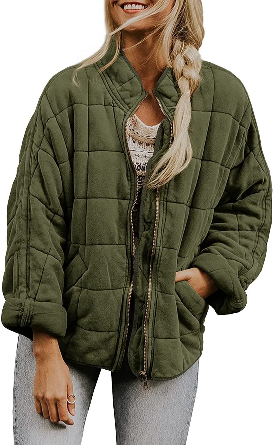 Woman wearing a green quilted jacket on a white background