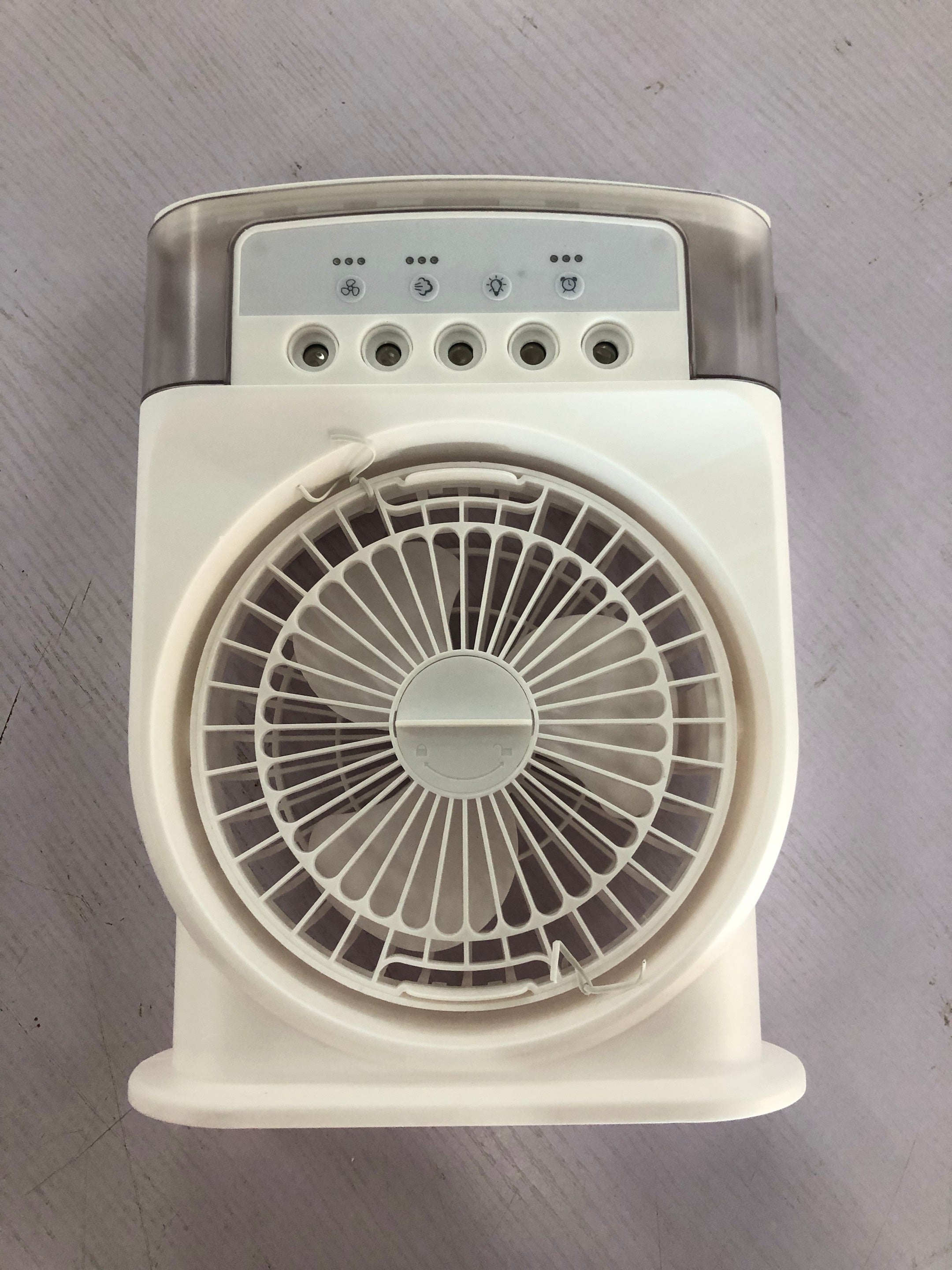 A white portable USB air conditioner cooling fan with a handle, featuring 7 color lighting and a water tank depicted in the image.