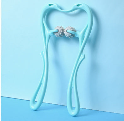 Light blue tooth-shaped holder with earrings on a light blue background