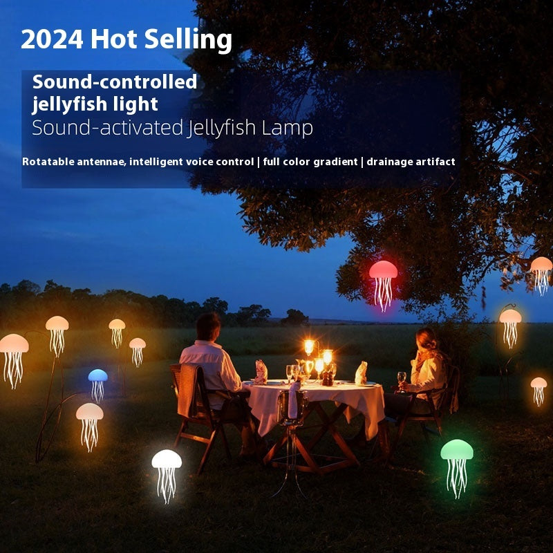 Sound-controlled jellyfish light in a garden setting with people sitting at a table.