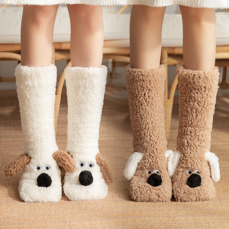 Pair of white dog-themed slippers worn by a person indoors.