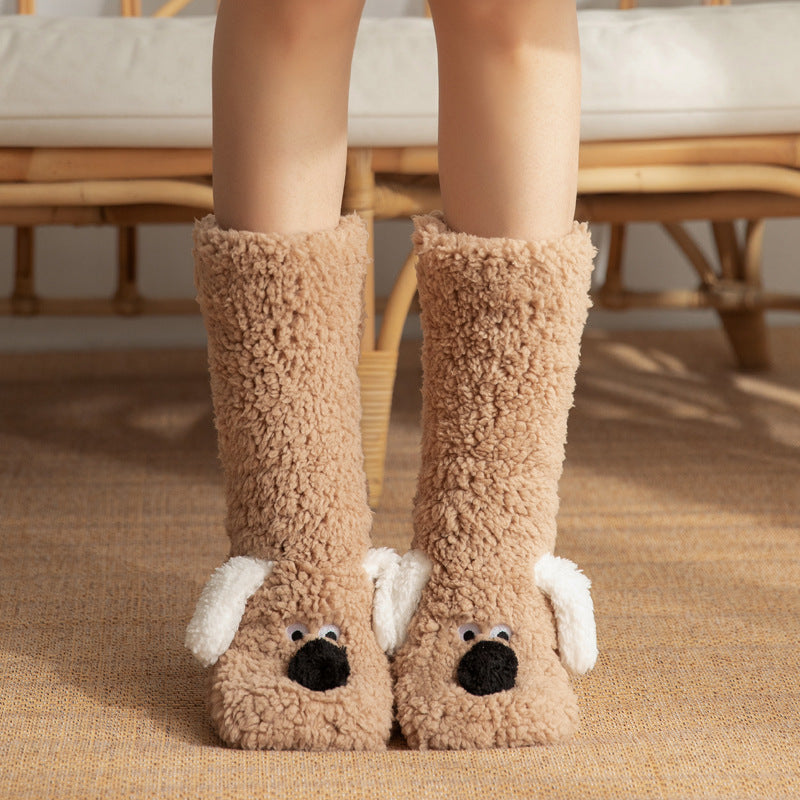 Beige dog-themed slippers worn by a person indoors.
