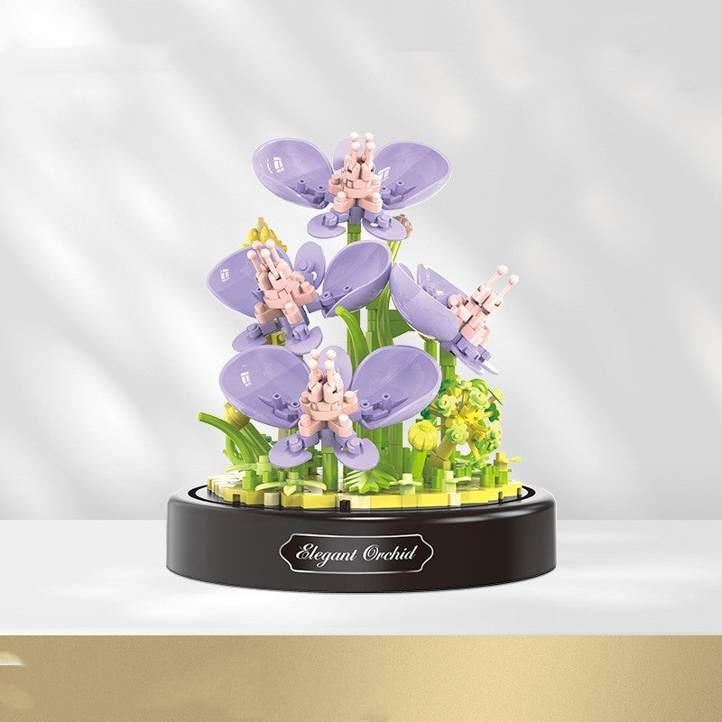 Decorative model of an orchid plant on a black base with 'Elegant Orchid' branding.
