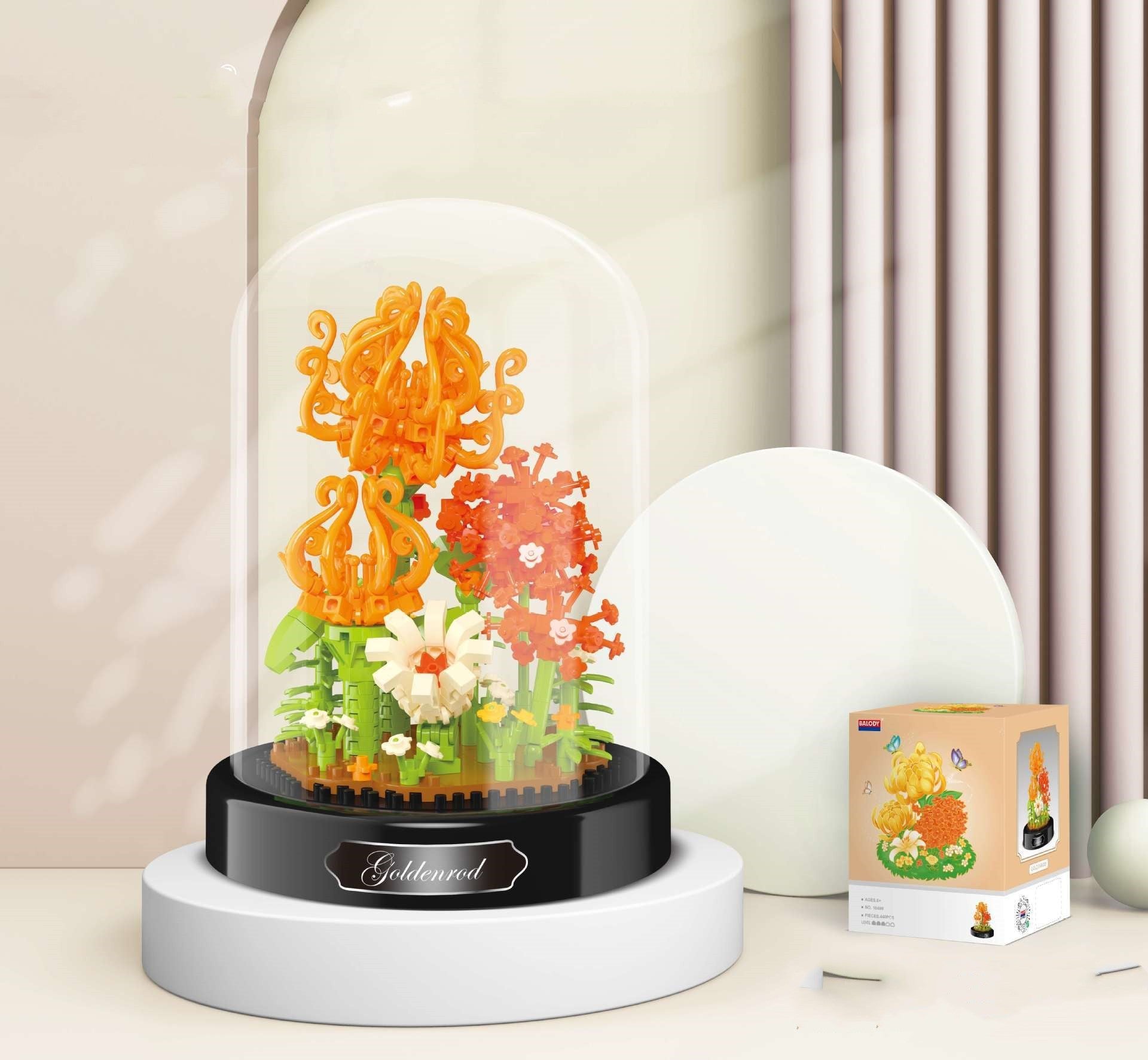 Decorative lamp with colorful floral design inside a glass dome on a white surface.
