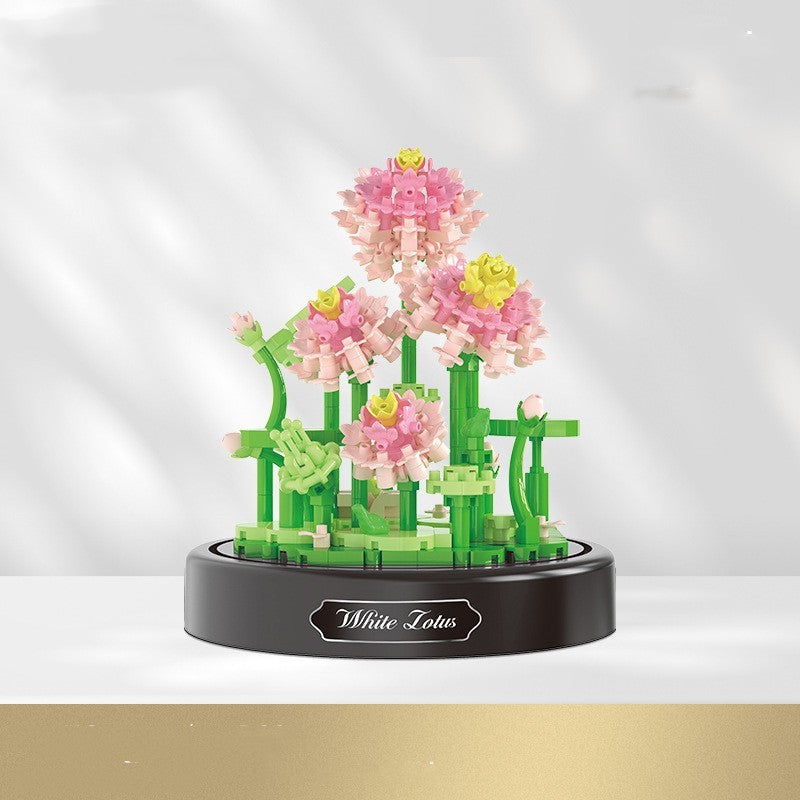 Decorative model of pink flowers and green plants on a white background