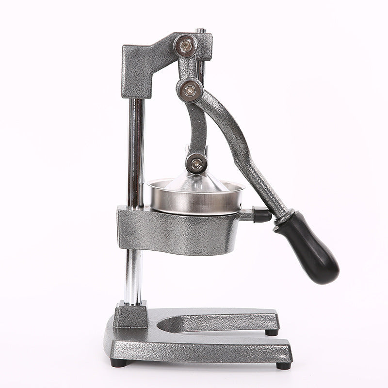 Metallic manual juicer on a white background