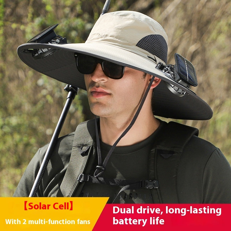 Person wearing a large sun hat with solar cell panels and fans, outdoors.
