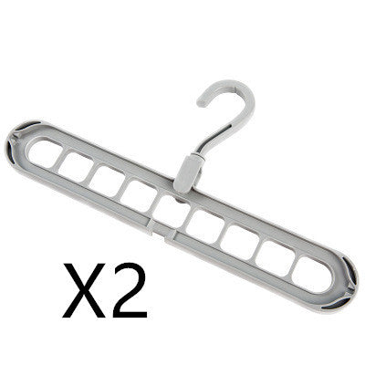 Metallic hanger with multiple hooks on a white background