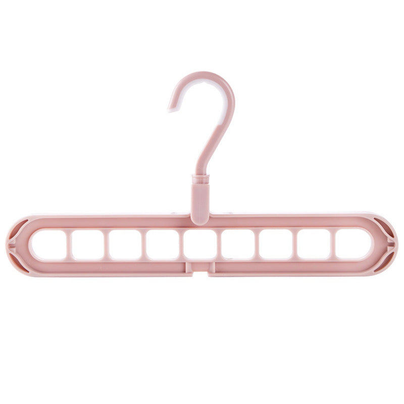 Pink plastic hanger on a white background