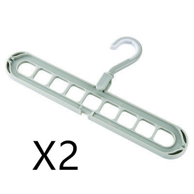 Light gray plastic hanger with multiple hooks on a white background