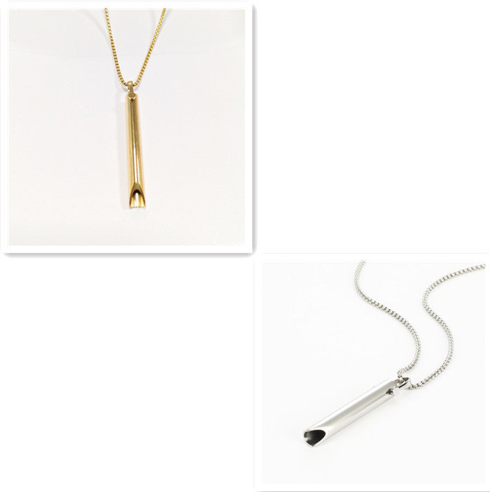 Gold and silver necklaces on a white background