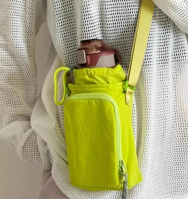 Yellow phone pouch attached to a white mesh bag