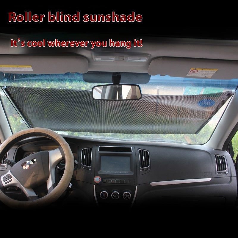 Car interior with a roller blind sunshade on the windshield