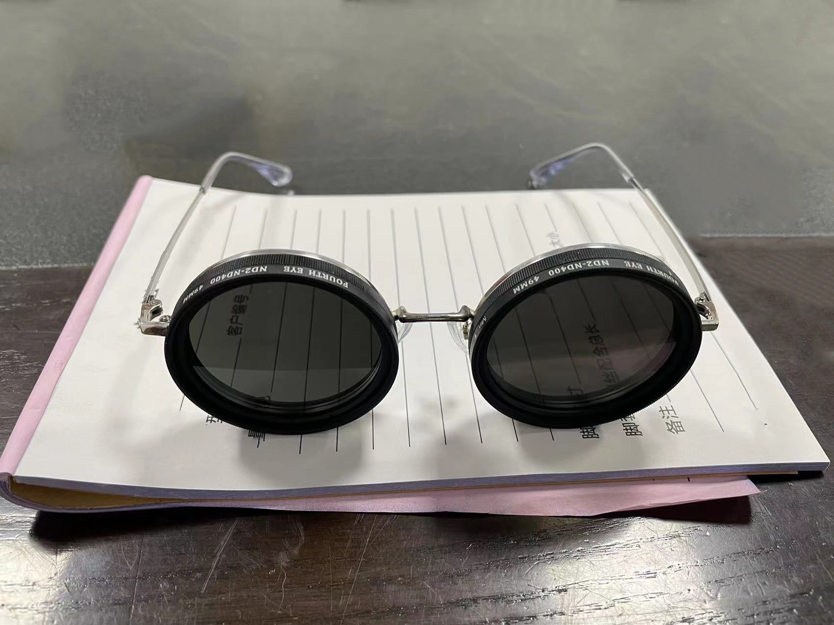 sun glasses on book