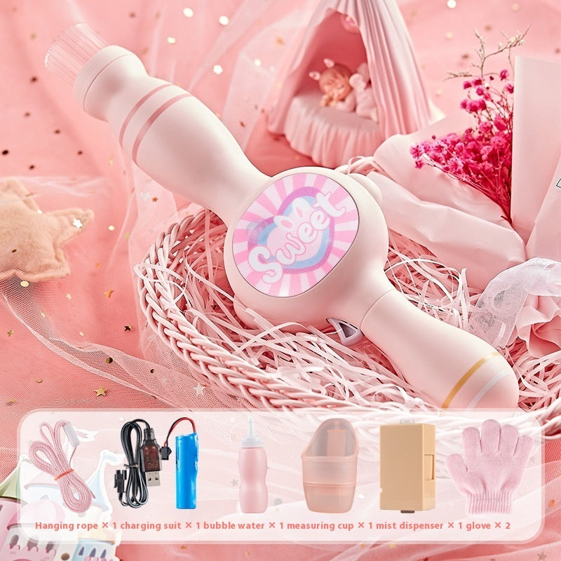 Pink bubble machine with accessories on a pink background