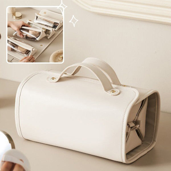 Beige toiletry bag with travel accessories on a neutral background