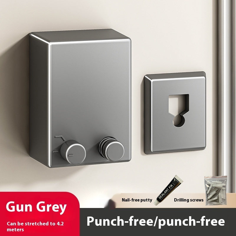 Gun grey wall-mounted light switch and cover plate on a white wall.