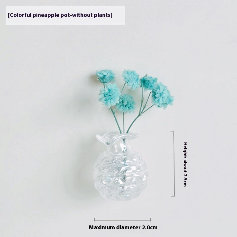 Clear vase with blue flowers on a white background