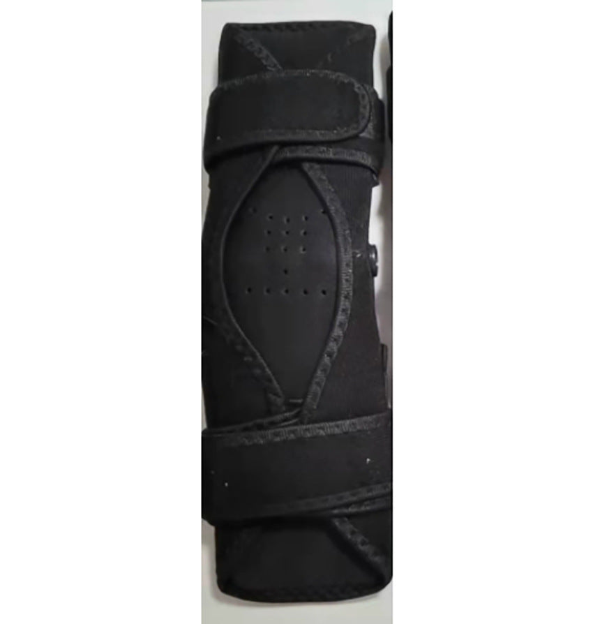 Black protective gear, possibly a knee or elbow pad, in packaging on a white background